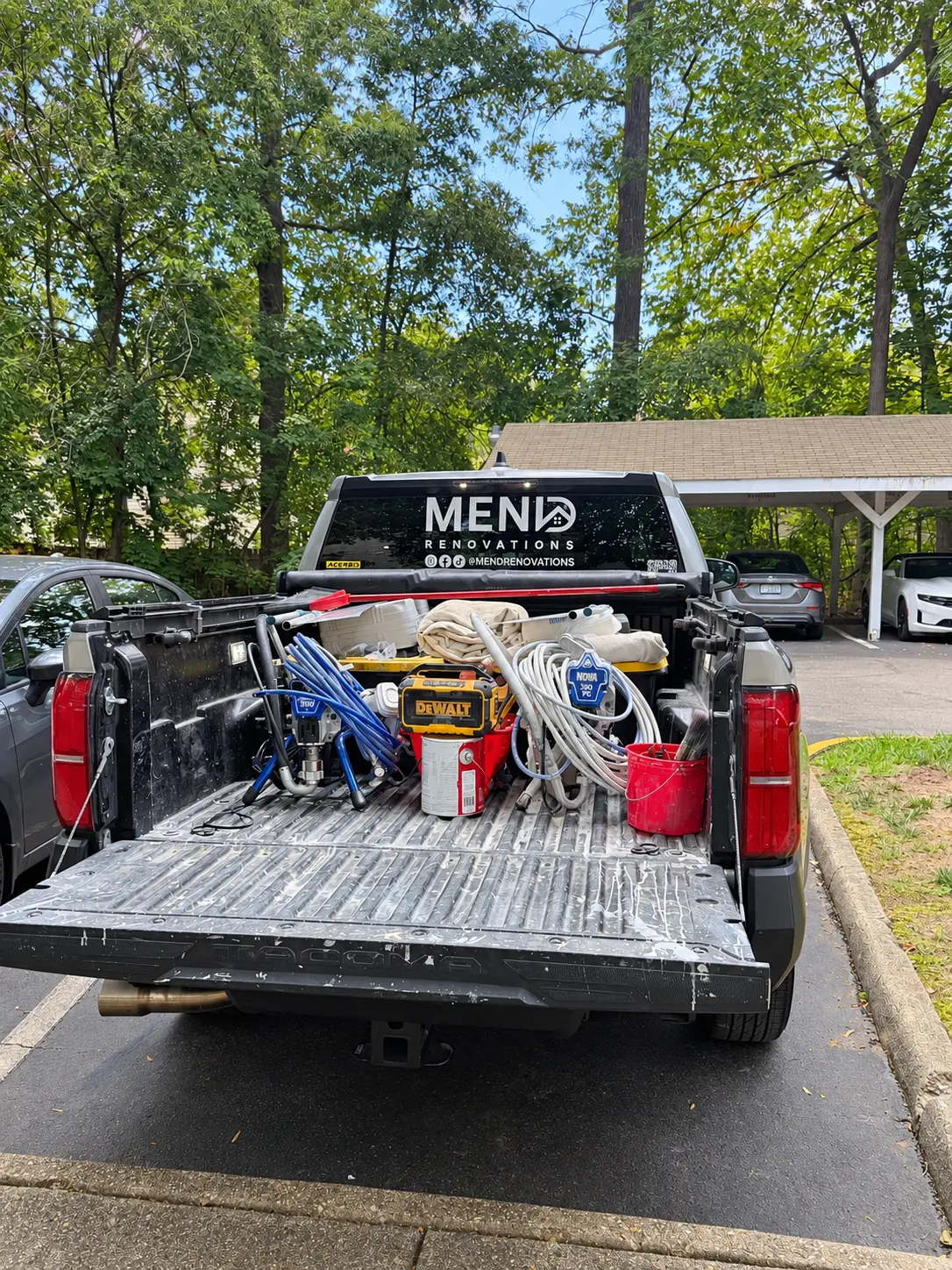 Mend Renovations truck bed loaded with tools and supplies